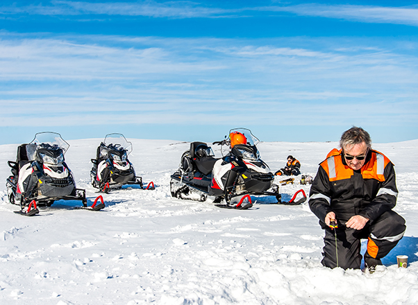 Nick Harman fishing on a frozen lake in Sweden