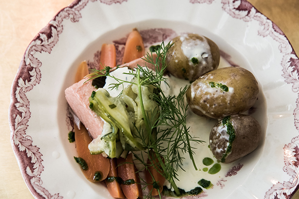 a dish of salmon, potato, carrot and dill at Lilla Saluhallen